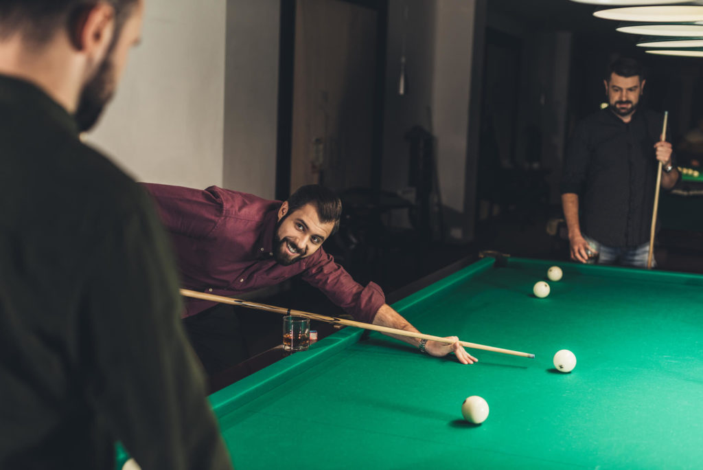 Men playing pool