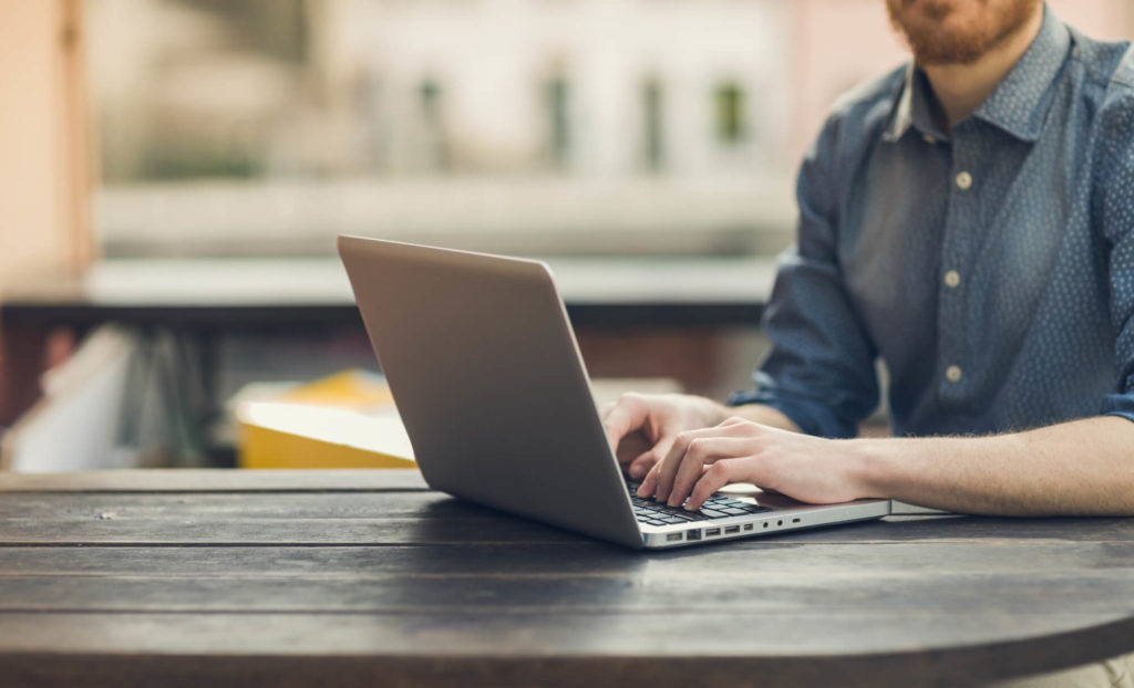 young man working on laptop