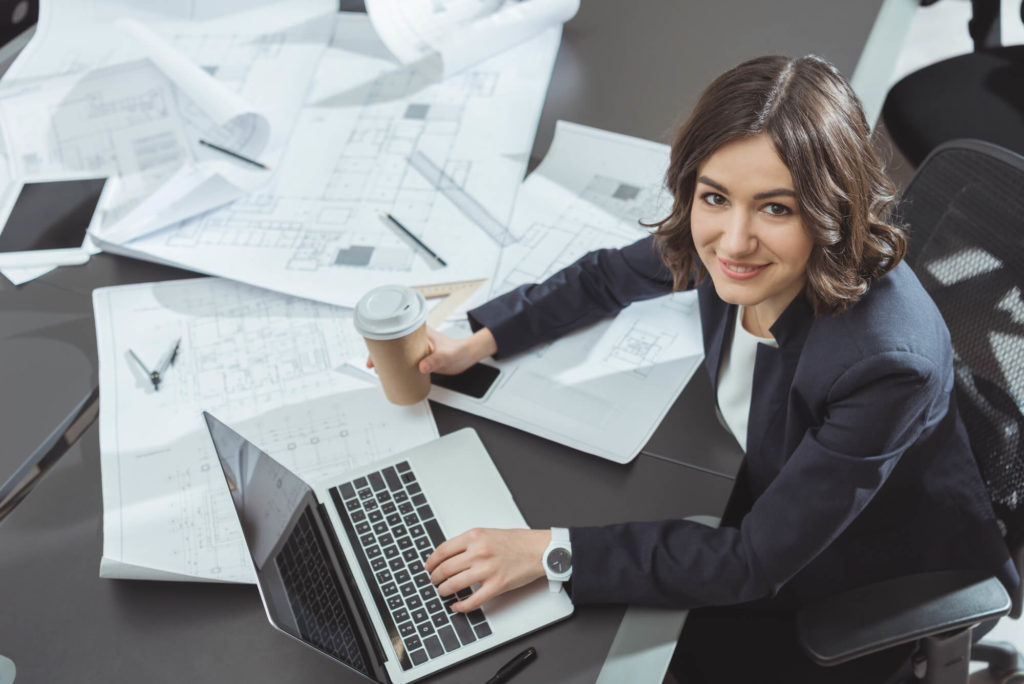 Female architecture working on laptop