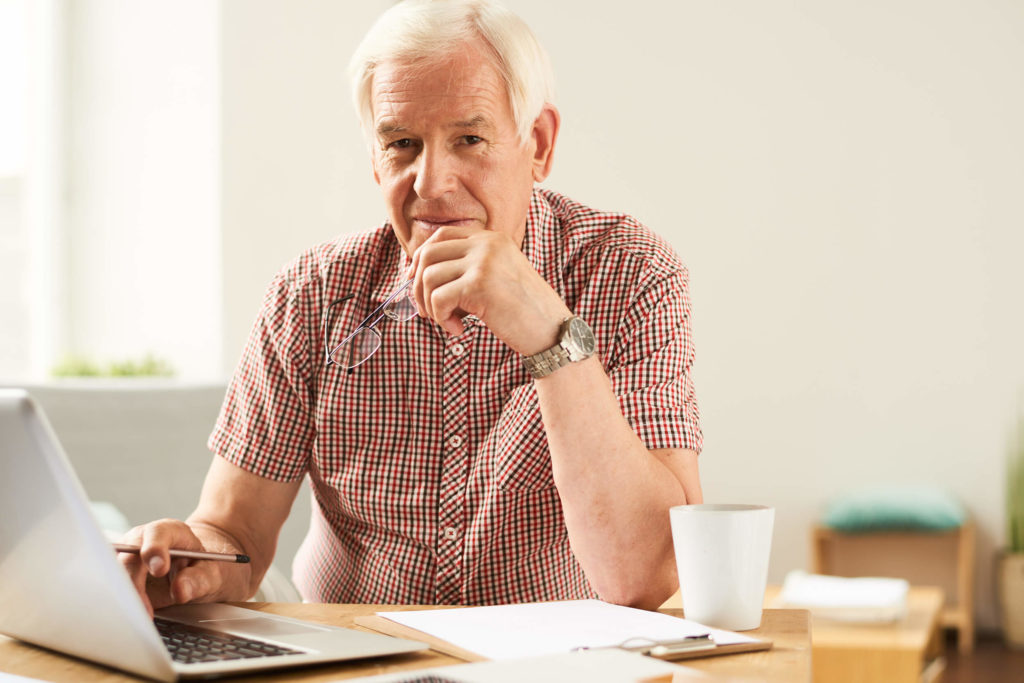 senior using laptop