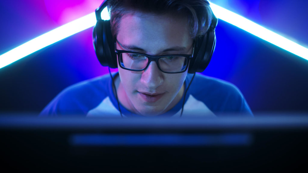 young video gamer with headphones