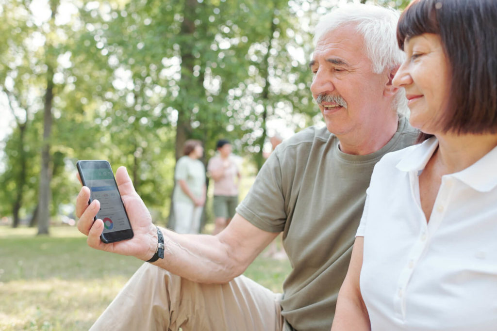 elderly couple with smart phone