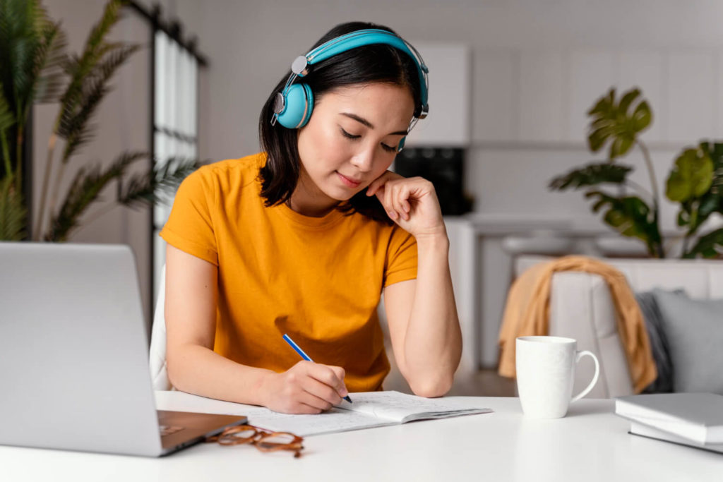 woman working on homework from online class